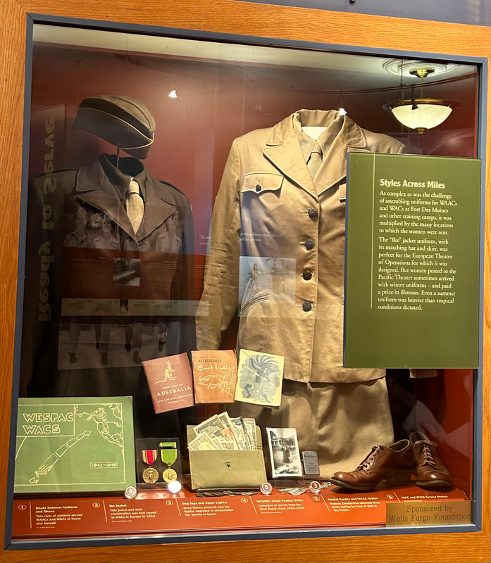 Static display of WWII WAC vintage uniform and miscellaneous artifacts.