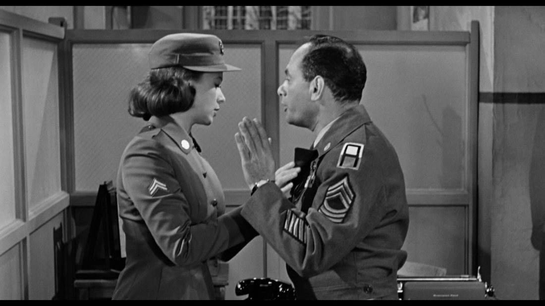 Black and white photo of the characters Master Sergeant Baker and Corporal Evans in the 1957 film Time Limit.