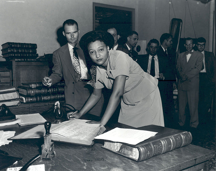 Ada Sipuel Fisher signing the register of attorneys, 1952, black & white photo
