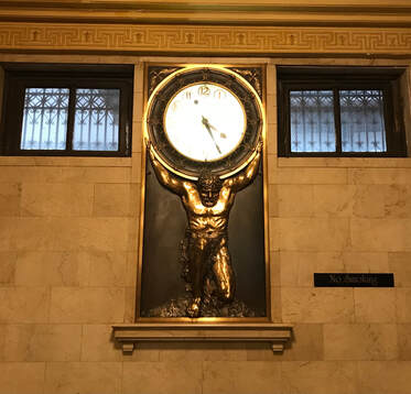 Atlas, Titan of Ancient Greek mythology, holding a clock on his shoulders rather than the heavens.  Atlas Life Building, Tulsa, Oklahoma, photo by Lynne Schall